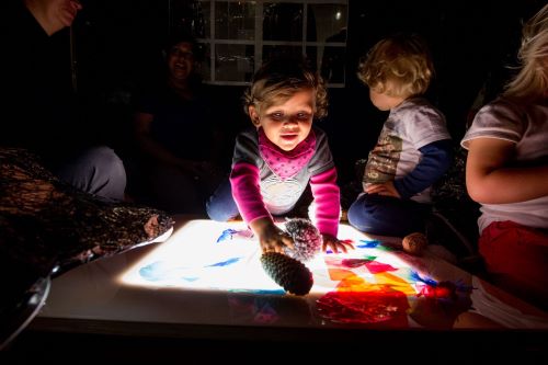 Toddler with a light